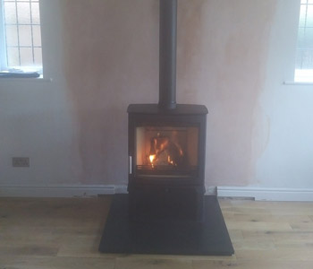Parkray Aspect 8 Slimline woodburner - with Store Stand and Poujoulat UK ltd External Chimney System with Slate hearth between Reigate and Dorking, Surrey. Another satisfied customer...